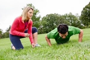 trainer coaching pushups