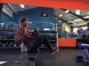 Weight Lifting for Weight Loss 2 female twisting with a weight