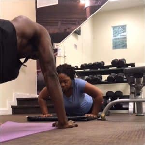 Apply a Hands-On Approach to Personal Training 2 push ups with client