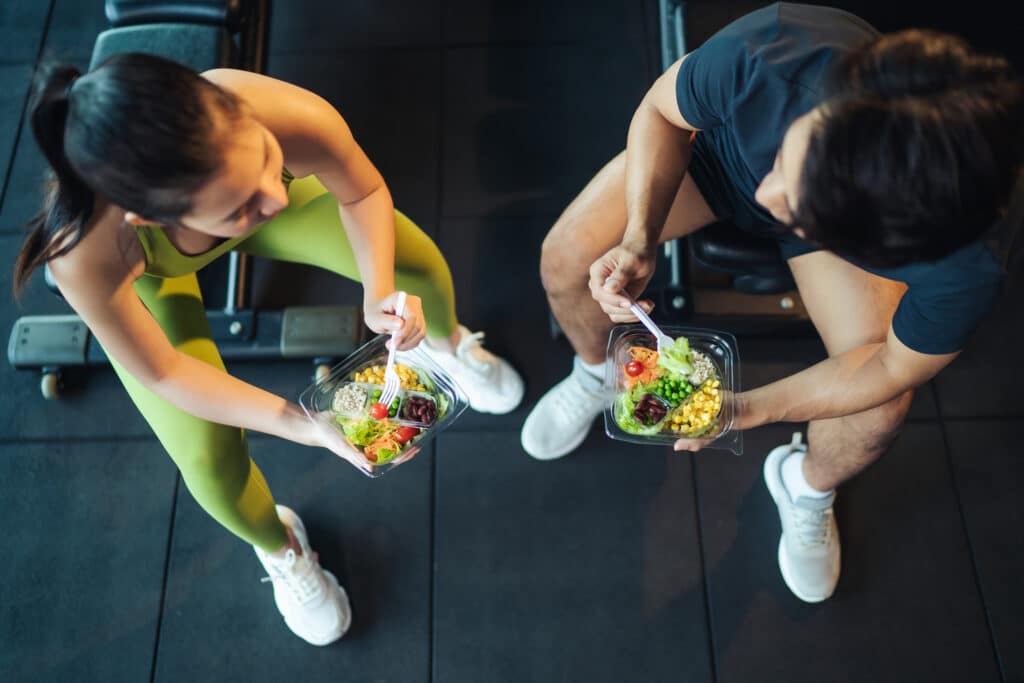 Personal trainer and fitness client working together for healthy nutrition habits