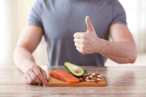 Protein or Total Calories: What's More Important for Hypertrophy? 1 Close Up Of Male Hands With Food Rich In Protein