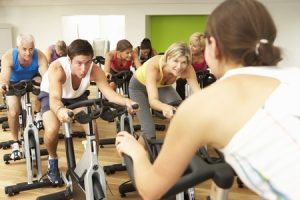 42249408 - group taking part in spinning class in gym