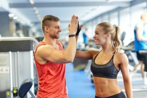 personal trainer giving high five