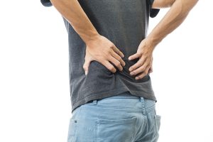 Man body discomfort lower back pain on whit background,