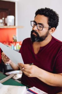 man looking at paperwork