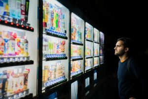 man staring at beverages