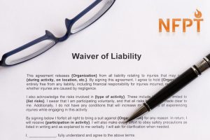 Waiver Of Liability On The White Paper With Pen